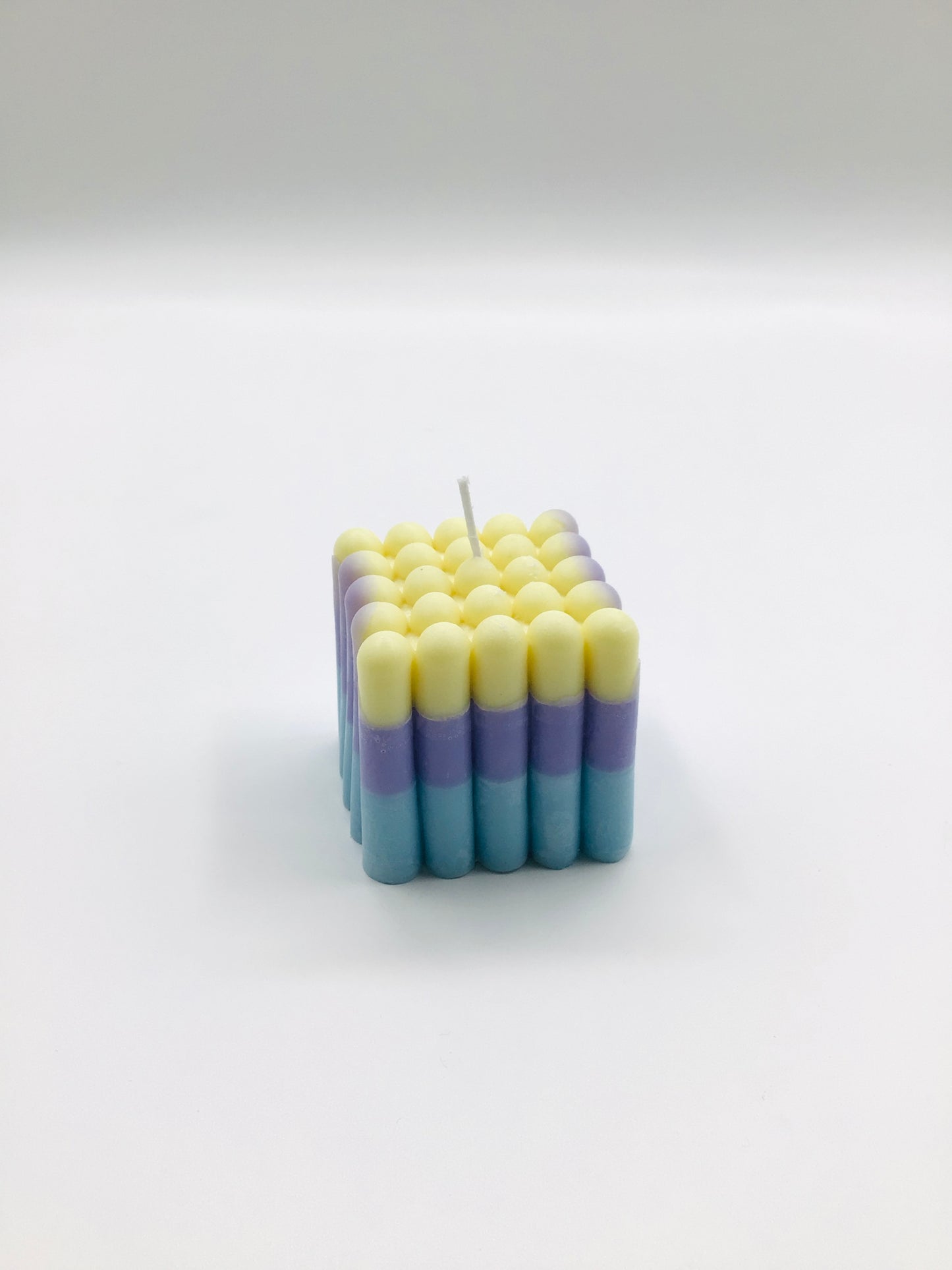 Rainbow sandcastle candle